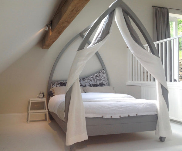 Modern plain curved four poster bed painted grey