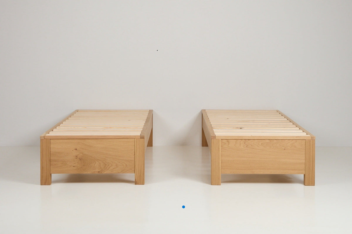 solid oak zip link bed frames shown separated as two single guest beds