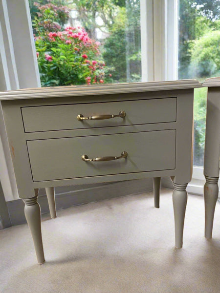 French bedside table nightstand with 2 drawers and turned legs. Antique shabby chic distressed painted finish.Made in the UK British furniture maker of artisan bespoke solid wood bedroom furniture.