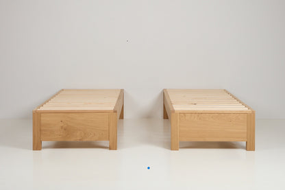 solid oak zip link bed frames shown separated as two single guest beds