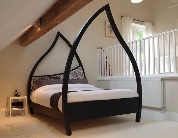Black four poster bed, curved  wooden high posts, 