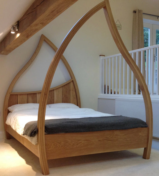 Solid Oak Four Poster Bed.  Curved wooden tall bed posts , arch design.
